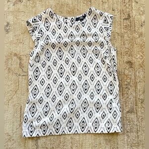 Pretty back and white tribal print cap sleeved blouse size XS.